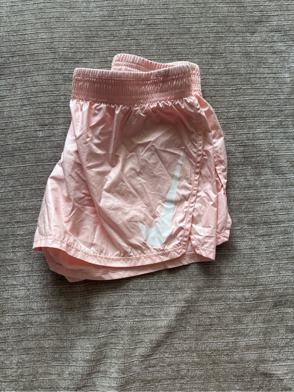 Nike Women's Light Pink Athletic Shorts with White Swoosh